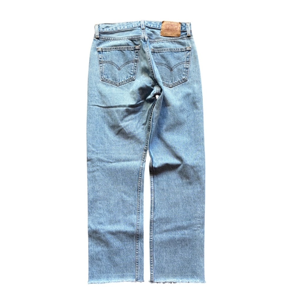 Vintage Levi's 501 Made in USA Raw Hem Light Wash Button Fly Denim Jeans
